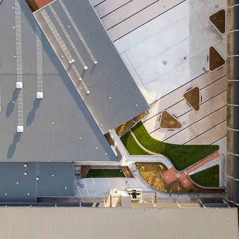 Aerial view of a roof, courtyard and landscaped forecourt